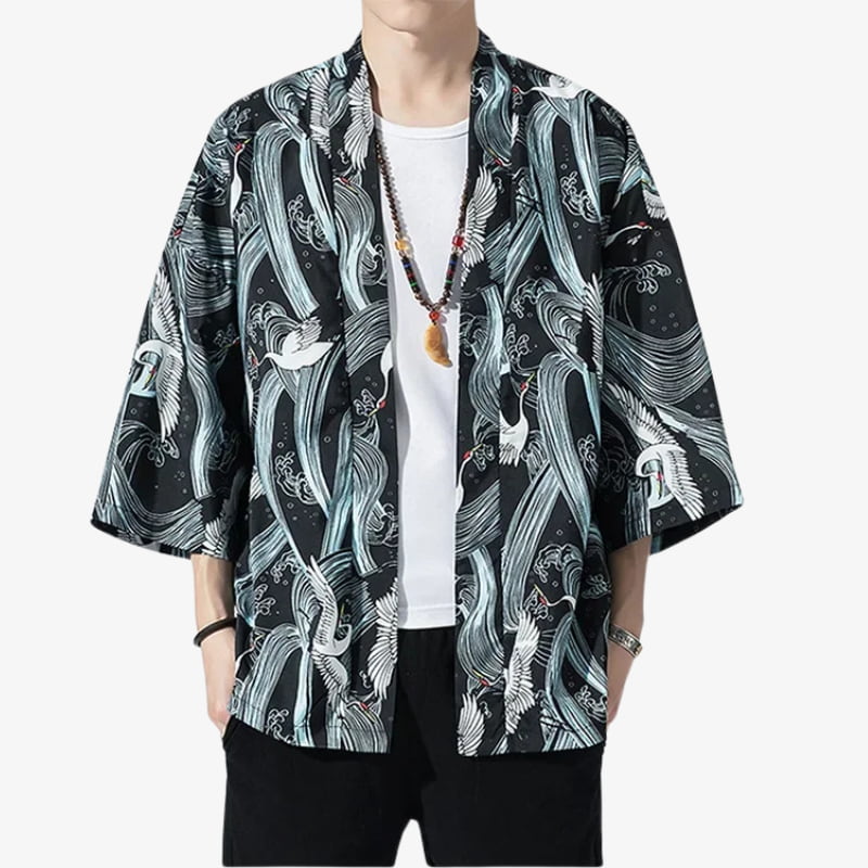 Person wearing a black Kimono Style Mens Jacket with white Tsuru birds patterns on a white background