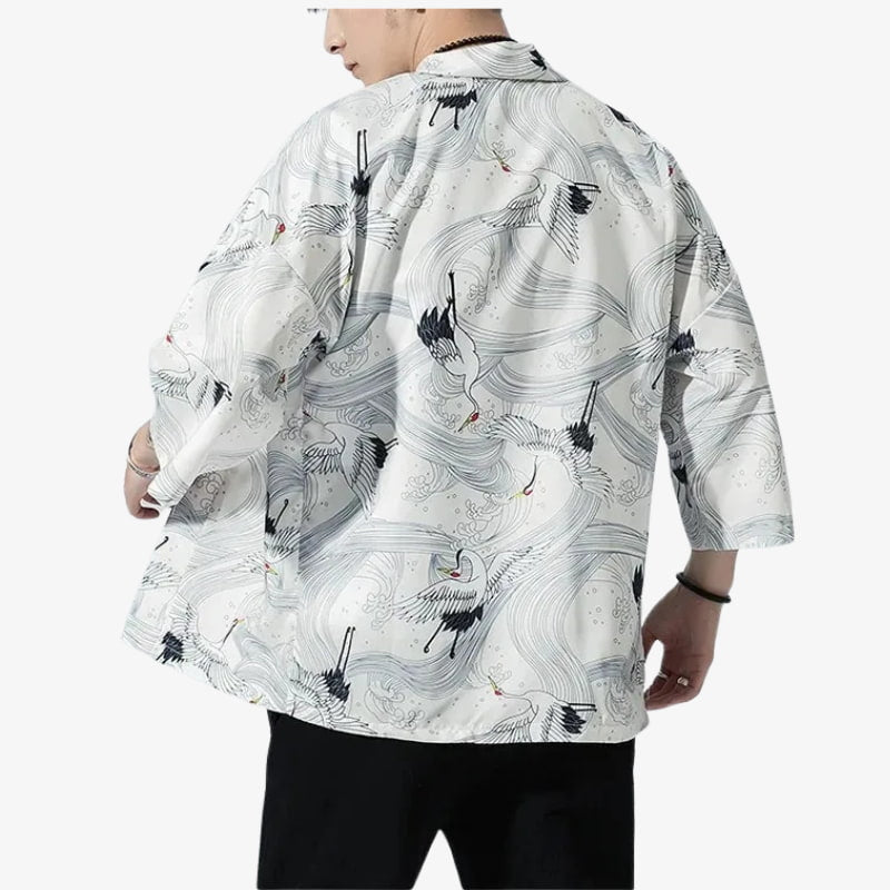 Person wearing a white haori kimono-style shirt with black crane designs on a white background