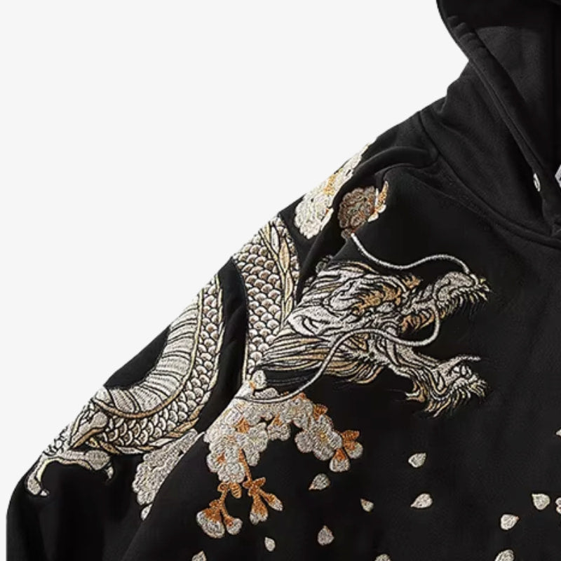 Black dragon hoodie with intricate embroidery on a white background