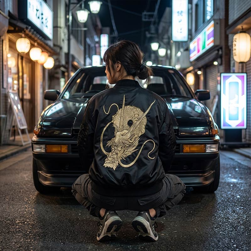 woman wearing a black dragon bomber jacket in a Japanese urban setting
