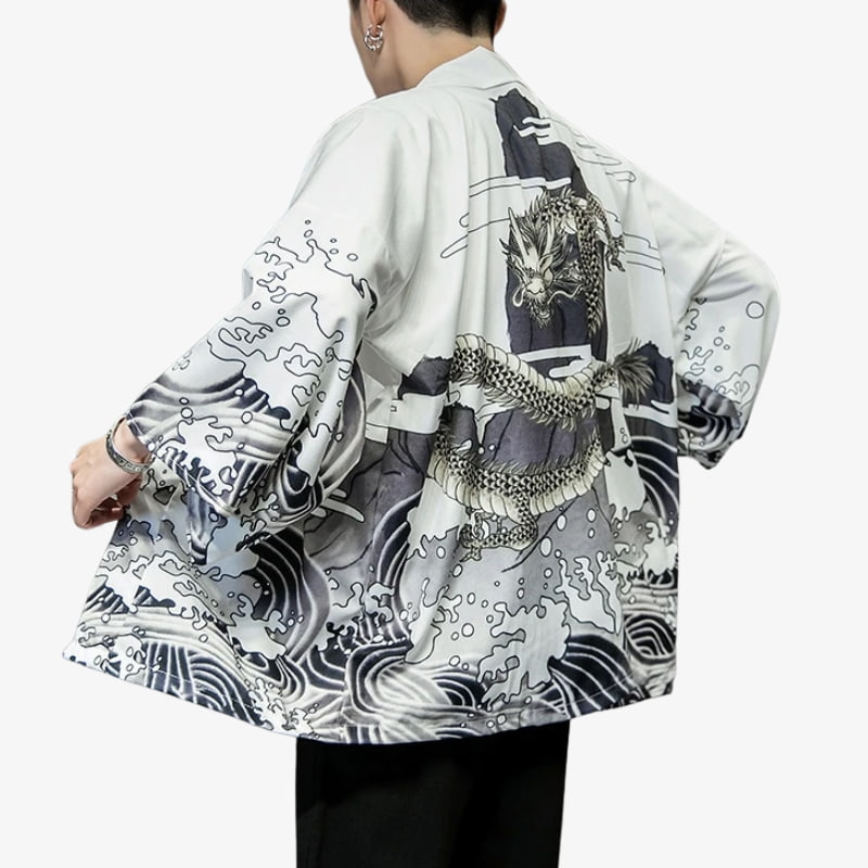 Person wearing a white Dragon print kimono adorned with bold mythical imagery on luxurious fabric, blending folklore with modern fashion.