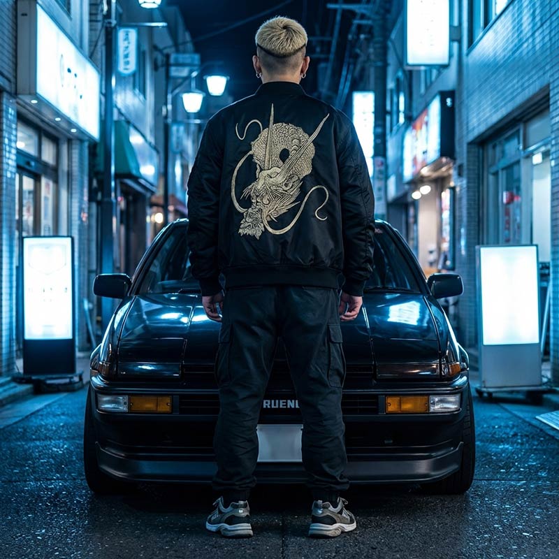 Man wearing a black Japanese jacket sukajan with a dragon design in a Tokyo street