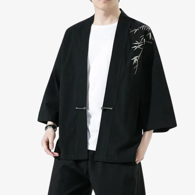 Person wearing a japanese kimono haori style jacket with white bamboo embroidery on a white background