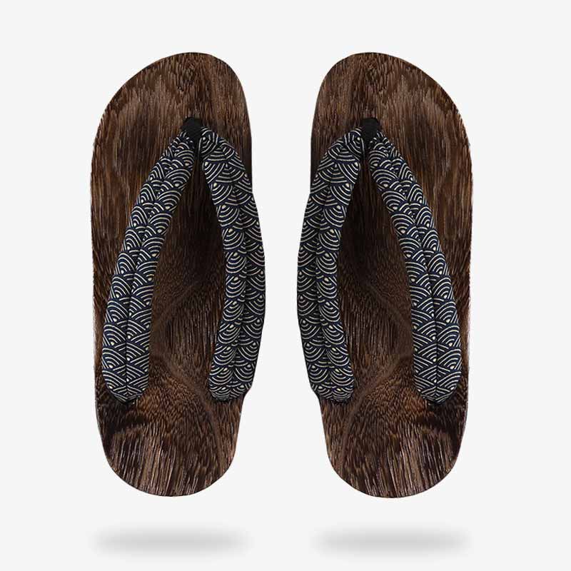 Japanese sandals made of polished wood, traditional design motif with fabric straps.