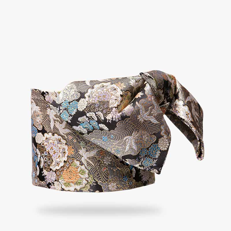 This kimono obi belt pattern is embroidered with Japanese symbols. It is a handmade belt that holds the kimono in place with a bow.
