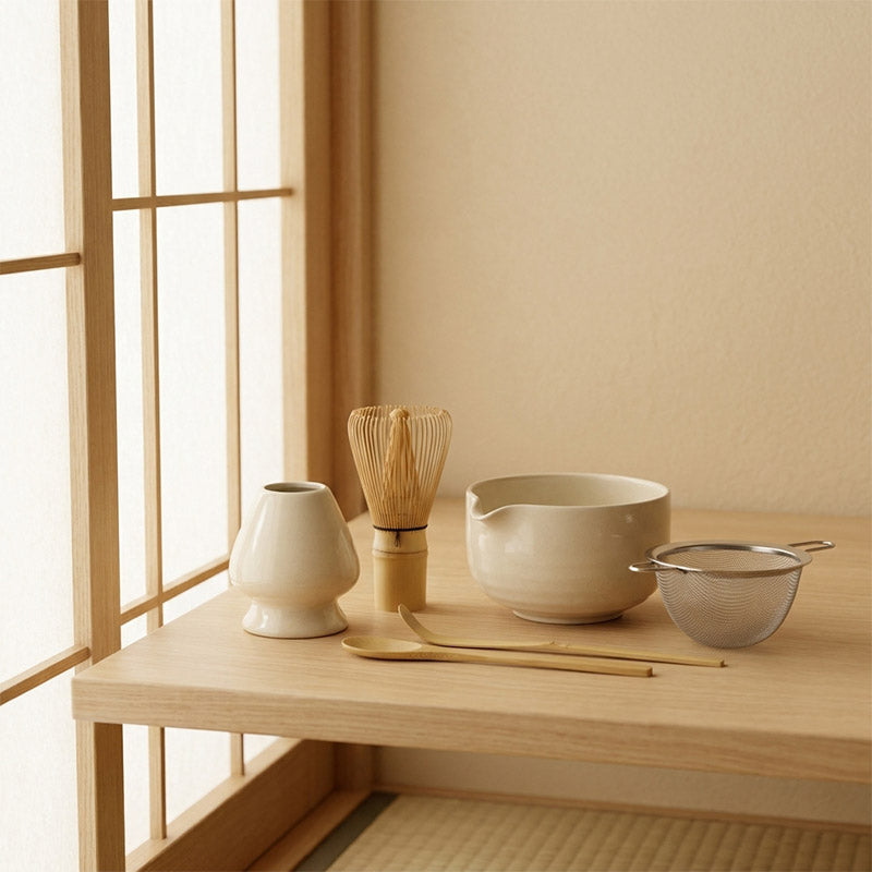Japanese matcha Tea-making utensils on a wooden table with a shoji window