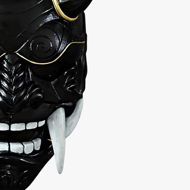 This black oni mask demon is a handcrafted artifact, made from high-quality materials, hand-painted and sculpted with horns and sharp white teeth to depict the legendary Japanese demon.