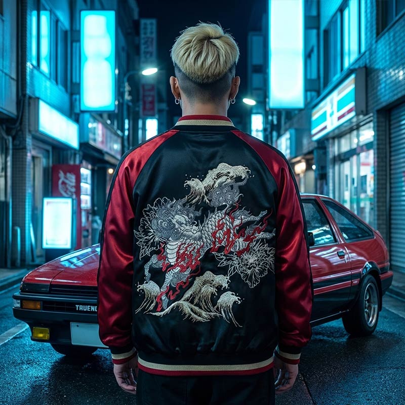 Person wearing a black and red Japanese souvenir jacket with a kirin design in an urban tokyo setting