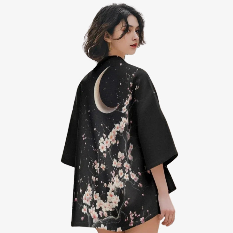 a woman is dressed with a Sakura kimono with delicate cherry blossom and moon patterns, evoking the beauty of Japanese spring.