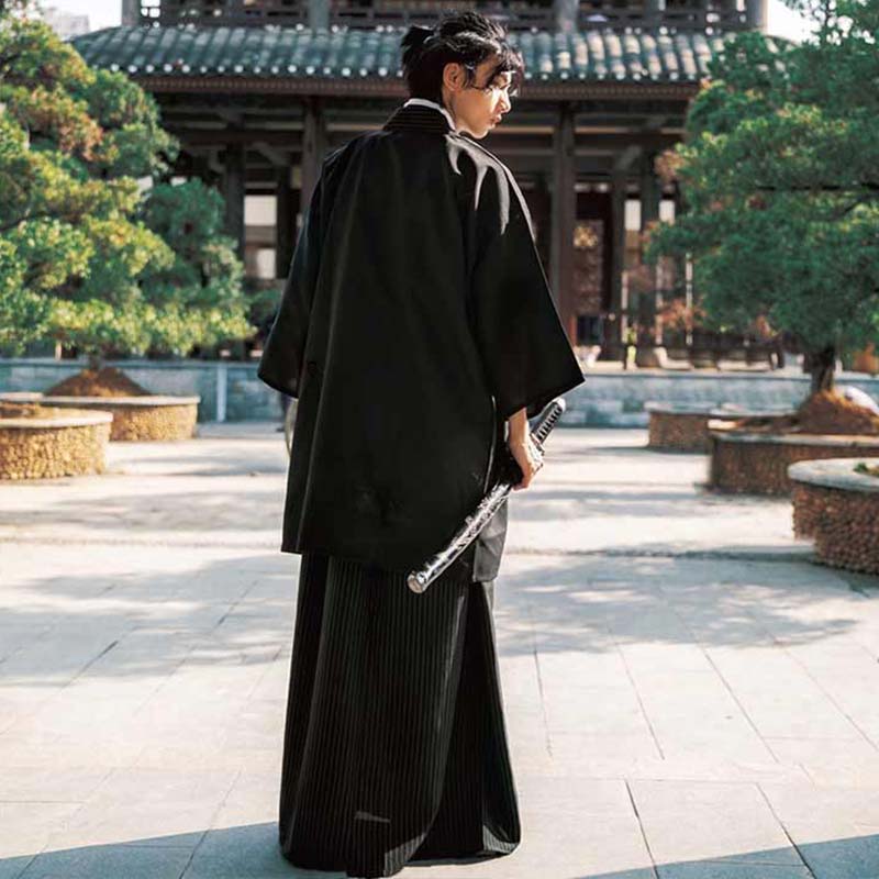 A traditional japanese kimono for royal men in a garden with a Japanese temple