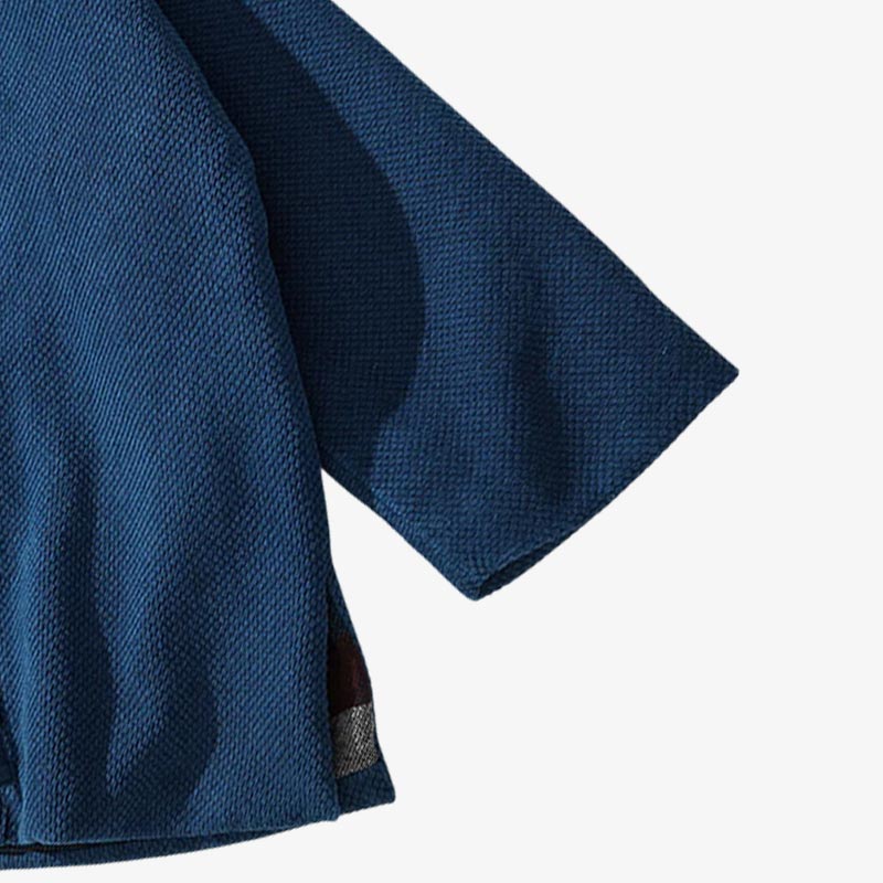 Vintage Japanese kimono jacket crafted with minimalist indigo tones, reflecting timeless Japanese artistry