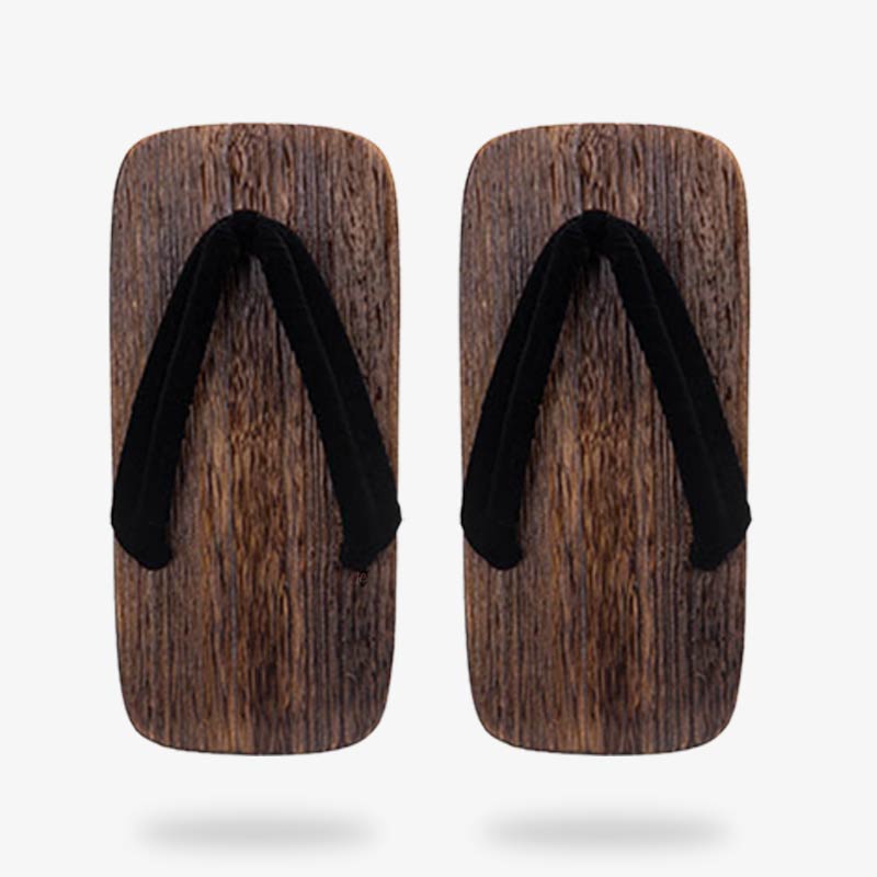 Two vintage Japanese wood sandals, showcasing historical footwear styles made with quality material and black strap