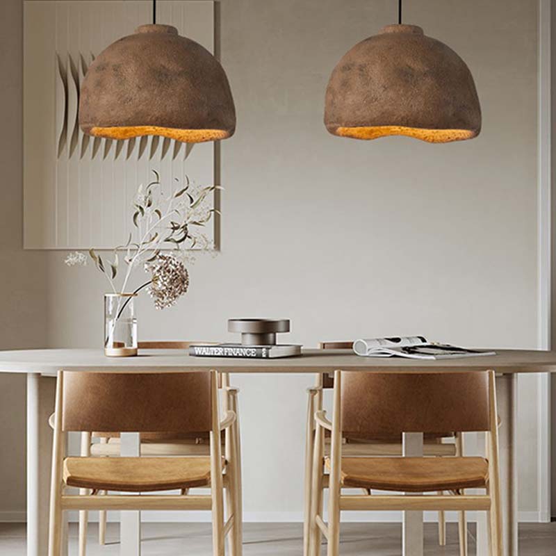 Two wabi sabi Japanese chandelier with a white table and wood chairs