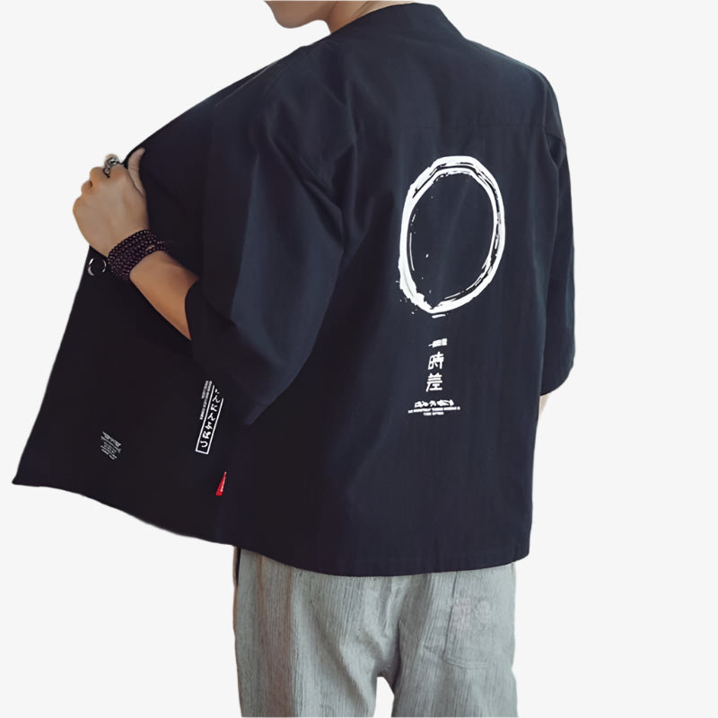 Person wearing a black Japanese Haori kimono-style jacket with white circular design on the back, on a white background.