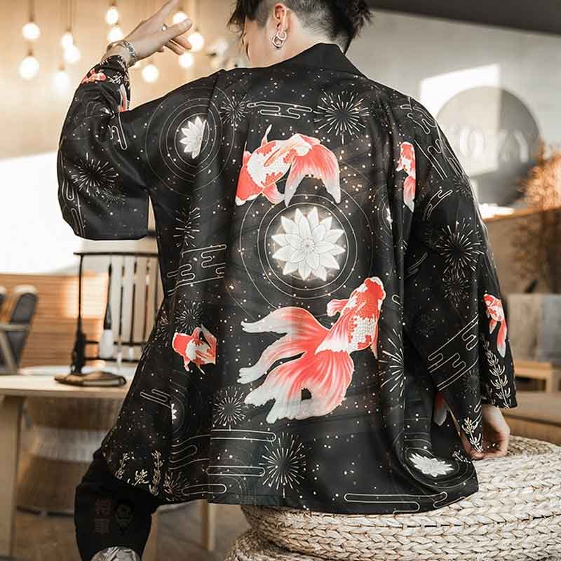 A man wearing a black men street Haori kimono jacket with a red koi fish and floral patterns, standing in a room with Japanese-style decor.