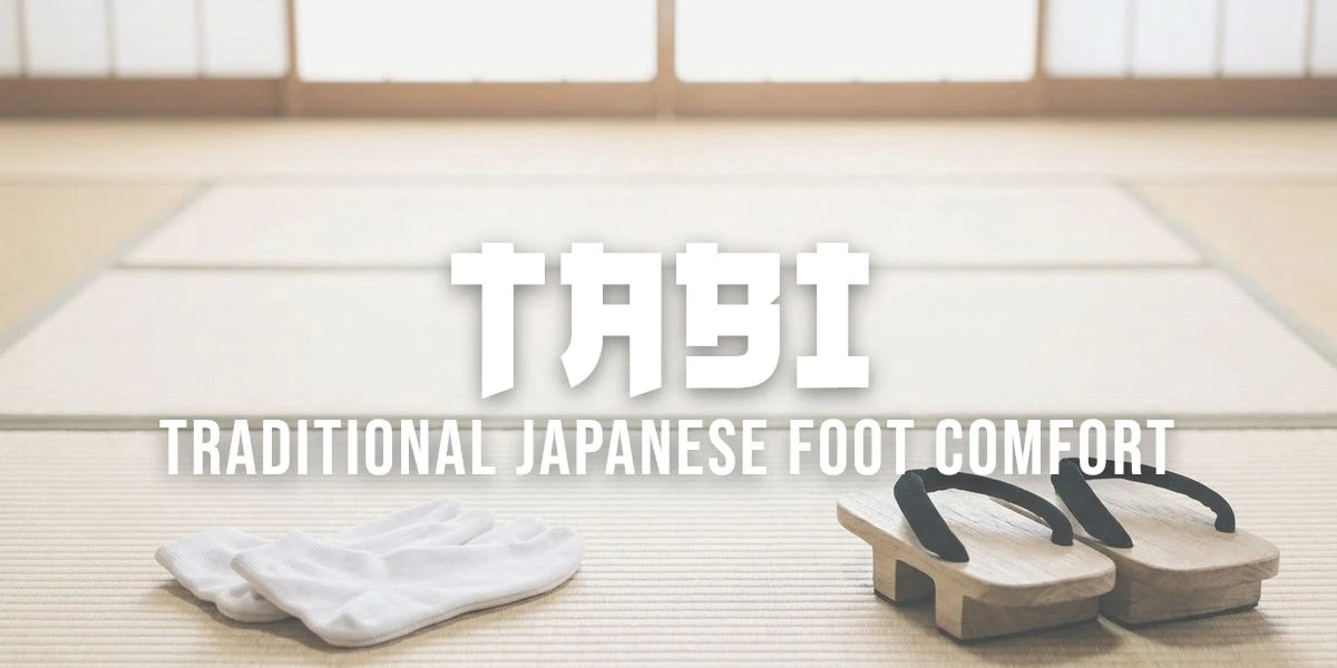 White split-toe tabi socks laid on a tatami mat beside wooden geta sandals in a bright Japanese room