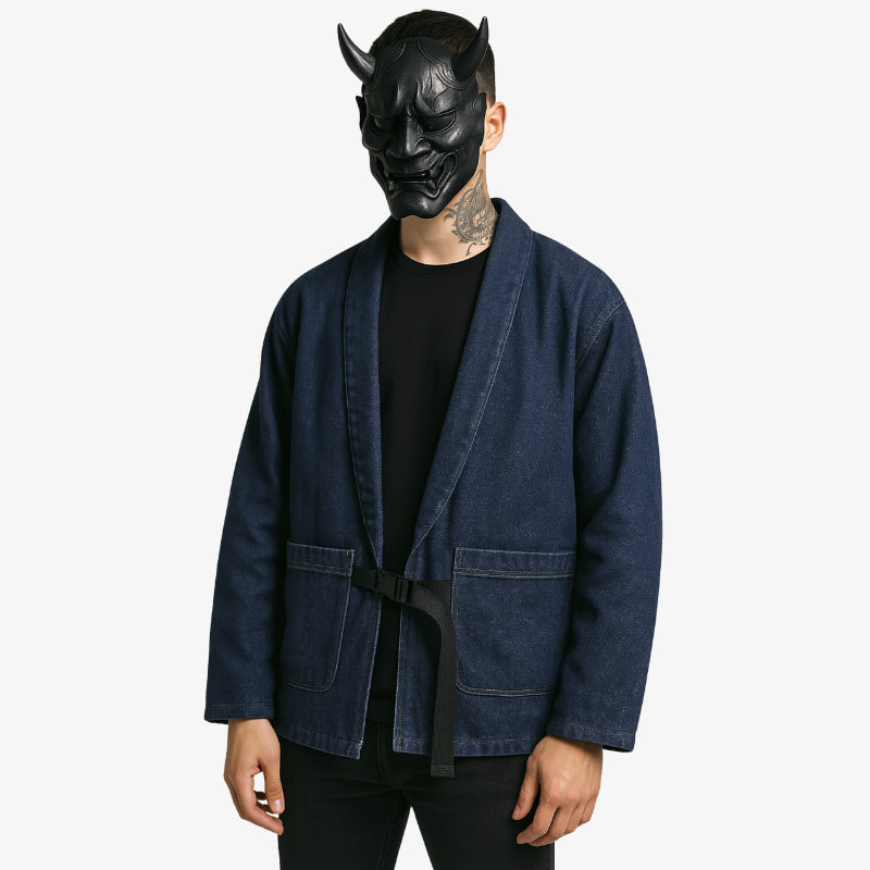 Person wearing a blue haori denim kimono jacket and black oni mask with horns on a white background