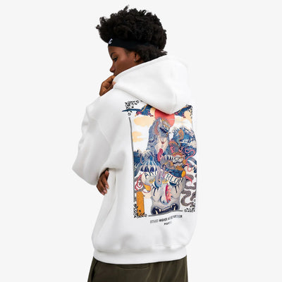 Person wearing a white hoodie Japanese with a colorful graphic on the back against a white background. The symbols is a Ukiyo scene style wit h a komainu guardian