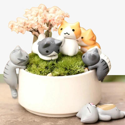 the cute kawaii Japanese cat figurines in a little fle pot