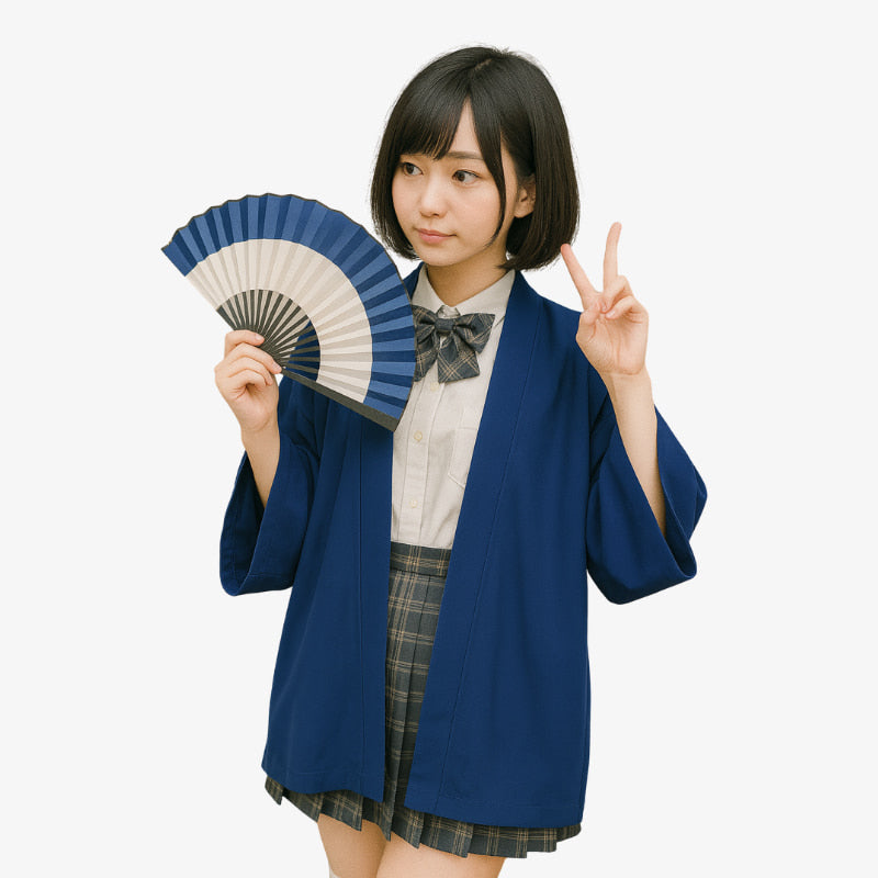 Japanese student in traditional Japanese jacket for women school uniform holding a blue and white fan on a white background