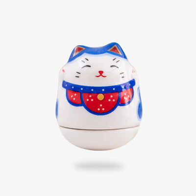 The white Japanese Lucky Cat Figurine is a traditional Japanese charm to bring wealth, prosperity, and luck
