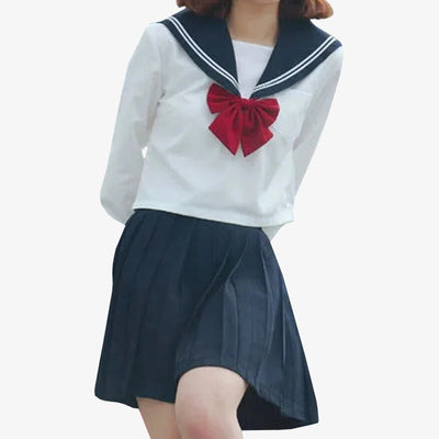 a girl is dressed with a Japanese Schoolgirl Uniform. A navy japanese skirt, and a long sleeves japanese school shirt for girl