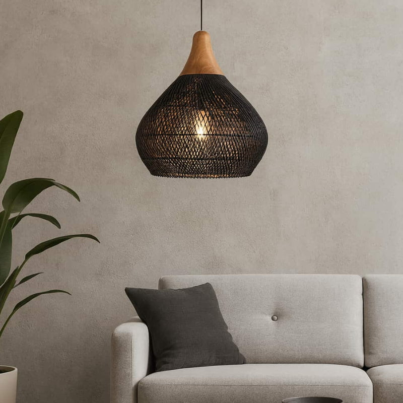 a Modern Japanese Style Ceiling Lamp pendant light hanging above a gray sofa with a plant on a neutral wall.
