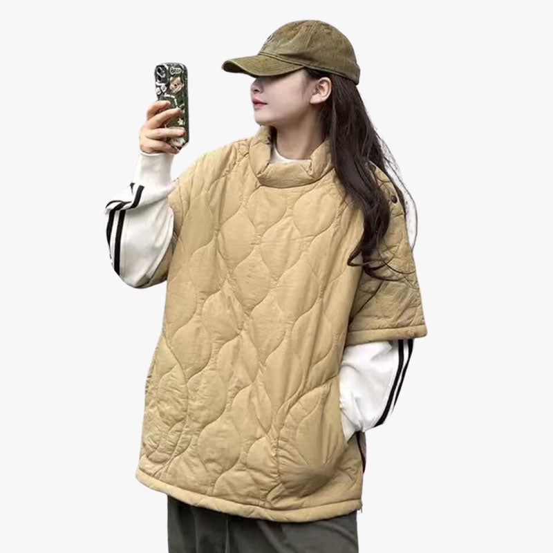 A woman is dressed in a women japanese streetwear sweatshirt in Khaki color and quilted material. The Japanese sweater has two side pockets