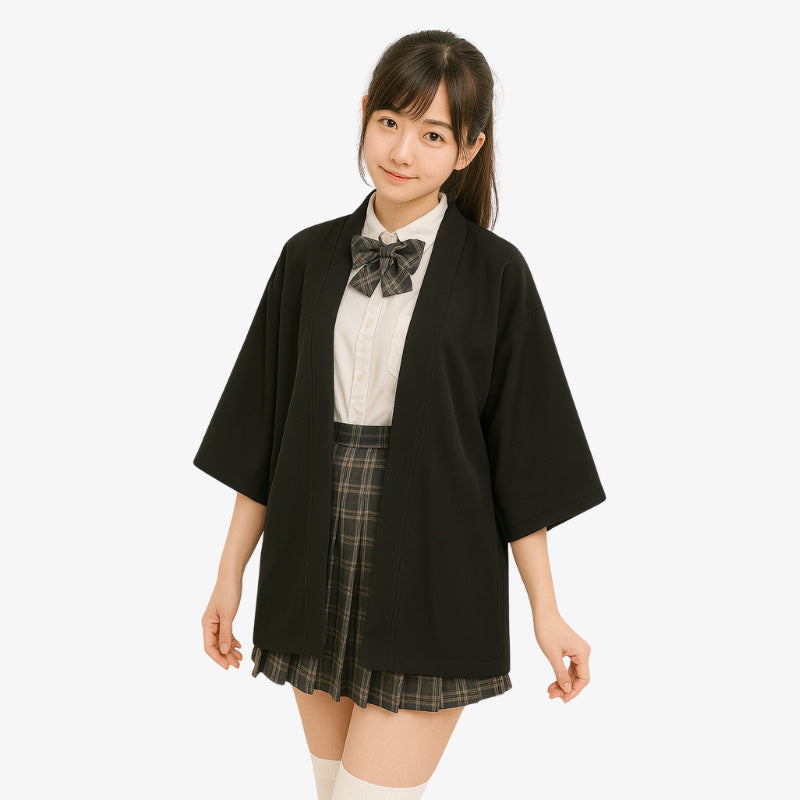 Person wearing a black Womens Kimono Jacket cardigan over a white shirt with a plaid bow tie and plaid skirt on a white background