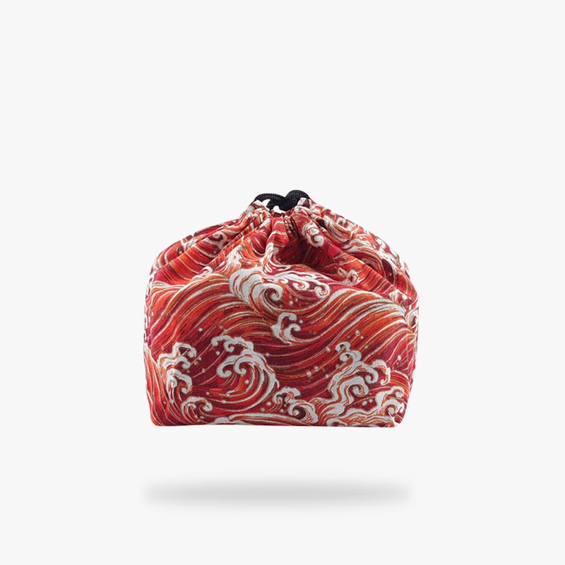 The Bento lunch bag is your ideal mealtime companion, offering convenience and style with compartments designed to fit a standard bento box snugly. Japanese wave pattern printed on quality cotton material