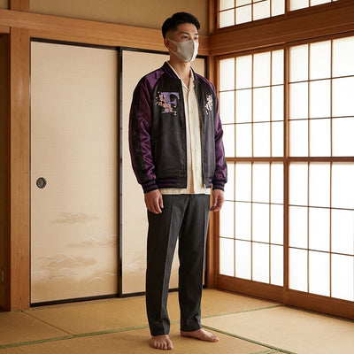 Man wearing a purple jacket with floral patterns in a traditional Japanese room.