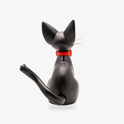 This Japanese Cat Figurine is black. It is a Japanese black cat piggy bank