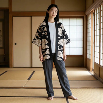Woman wearing a black haori jacket in a washitsu room with tatami and shoji screens