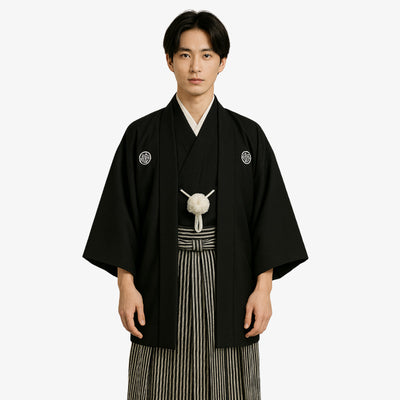 Black Japanese kimono featuring traditional family crests, paired with a classic haori jacket and striped hakama pants, crafted in authentic Habutae and Sendaihira fabrics.