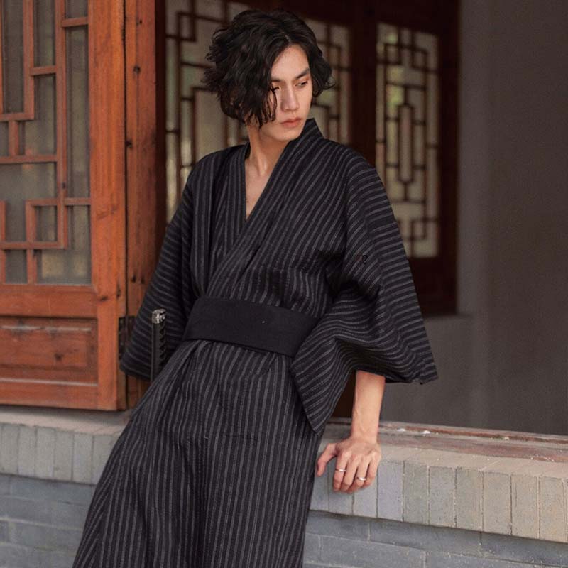 A samurai wears a kimono or Yukata fastened with a Japanese black obi belt for men. It's also called a Kimono Obi.