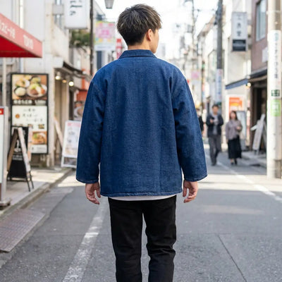 Back view of a blue haori worn in a Harajuku street, showing the full print