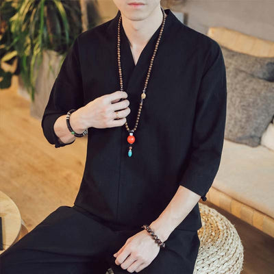 For a casual and zen outfit, buy a black Japanese shirt and a buddhist zen necklace
