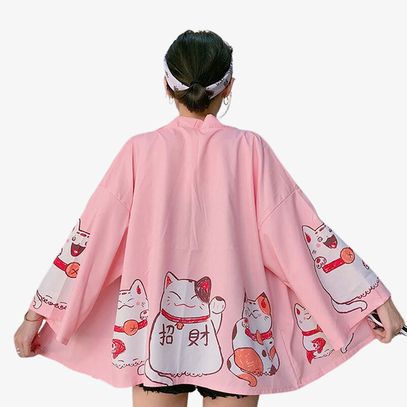 This cute kimono is in a charming pink color, adorned with delightful cat prints that add a playful touch to traditional Japanese fashion