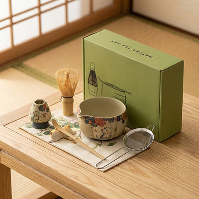 a cute matcha bowl set with a green gift box on a wooden table