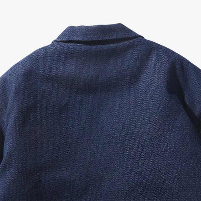 This image show the quality material of a Dark blue haori crafted with a minimalist style and indigo hues, ideal for versatile and refined looks