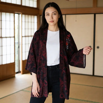 The dark red japanese cardigan seen from the front against shoji screens.