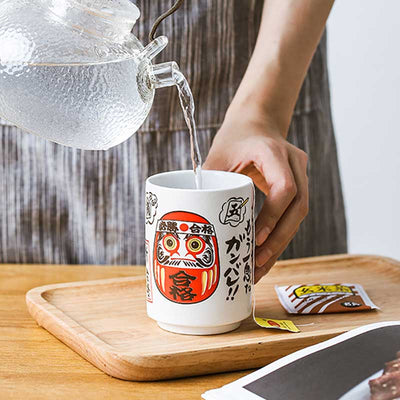 The Daruma cup features a classic red Daruma design, ideal for tea lovers who appreciate traditional Japanese symbolism and aesthetics