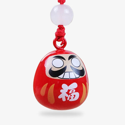 This Daruma doll keychain is a symbol of resilience and determination, a popular Japanese charm for motivation