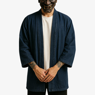 He is dressed with a denim kimono for men and white tokyo japan shirt for harajuku lovers