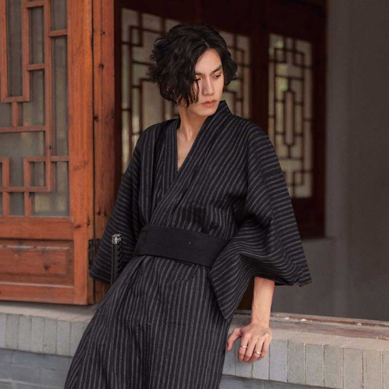 This Dress Japanese kimono for men is a Yukata. This Japanese garment is fastened with a black Obi belt.