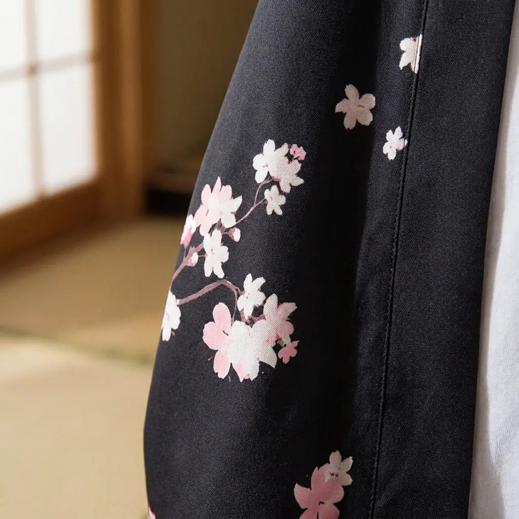 Close-up of the printed fabric and sleeve of a mens floral kimono