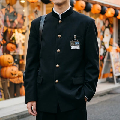 Side view of the black gakuran trousers showing pleats and side pockets