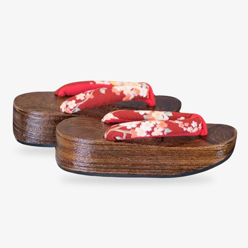 artistic wooden geisha style sandals, featuring unique decorations and raised soles.