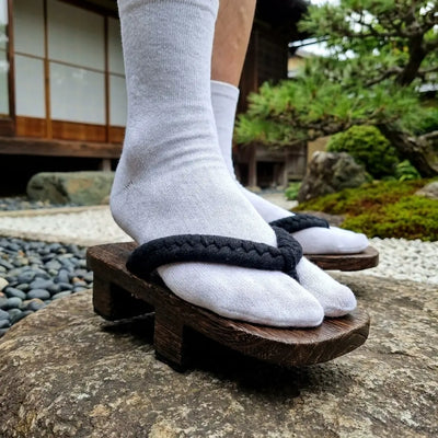 Close-up of the corded black hanao strap on Geta Japanese Man sandals