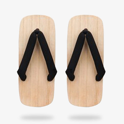 Wooden display of Japanese geta sandals for sale with black straps